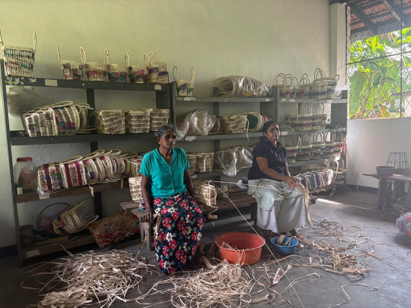 Women artisans producing handwoven baskets